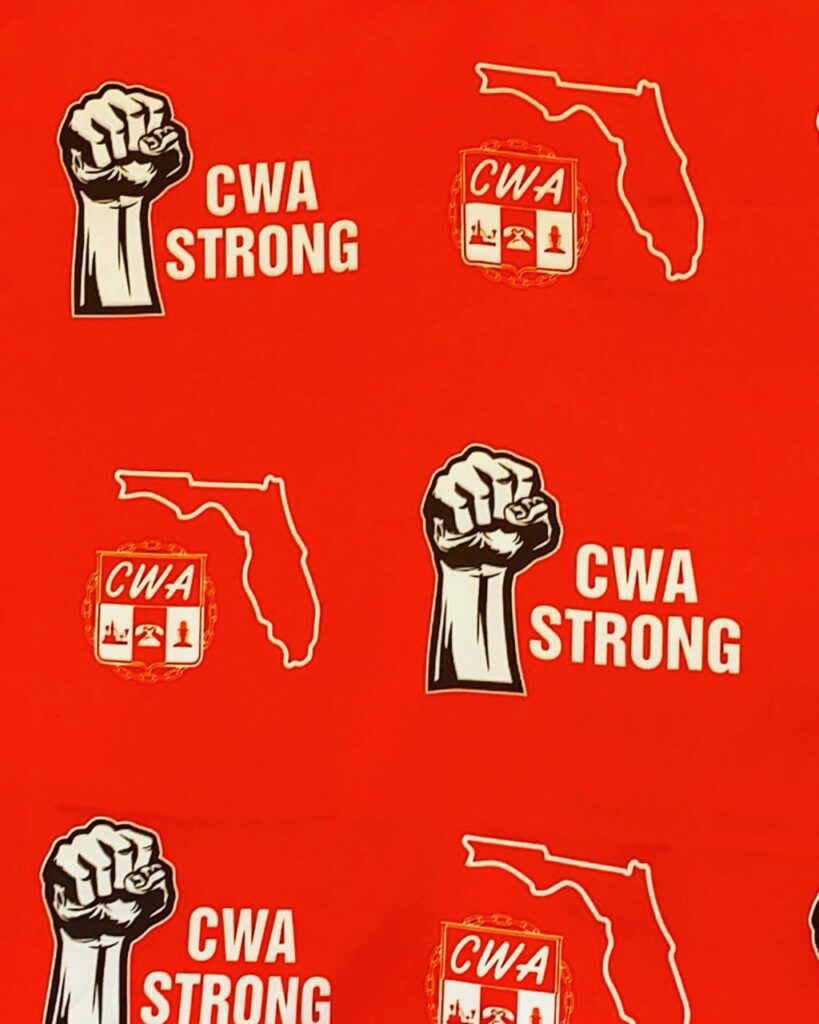 A red background with the words cwa strong and fist.