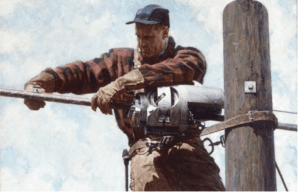 A lineman working on a power pole.
