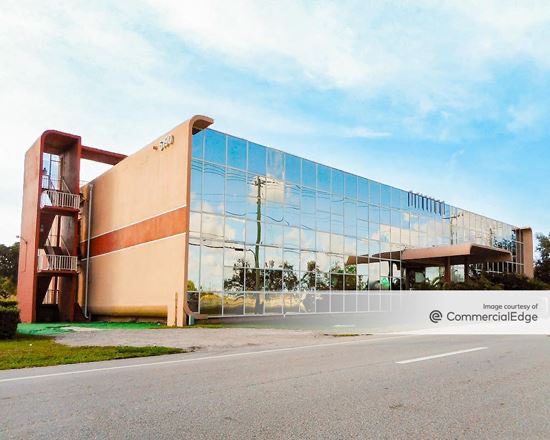 Modern office building with glass facade.